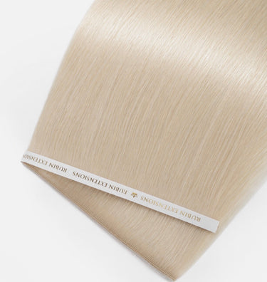 Close-up of silky, glossy Light Blonde human hair strands, Genius Weft – Rubin Extensions®