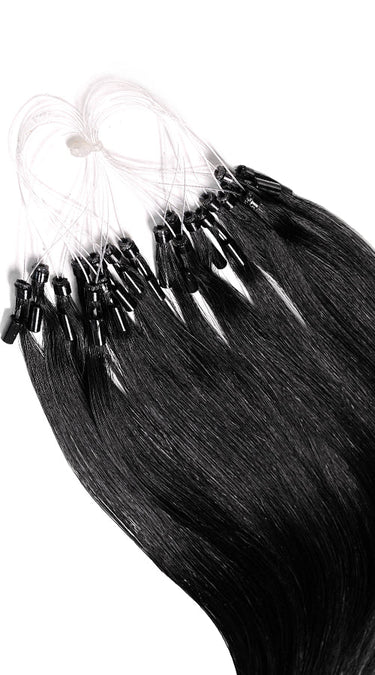 Close-up of individual Black microring strands, glossy Remy human hair – Rubin Extensions®